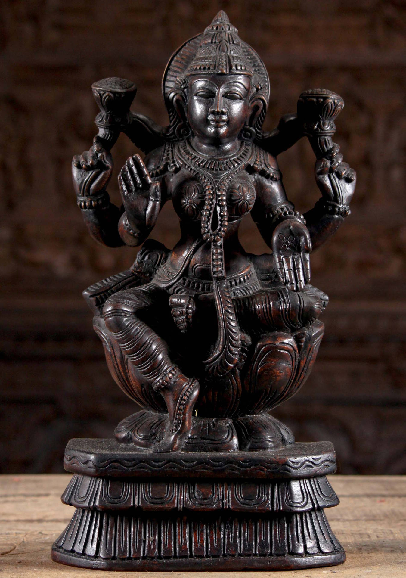 Wooden Lakshmi Devi Figurine Background