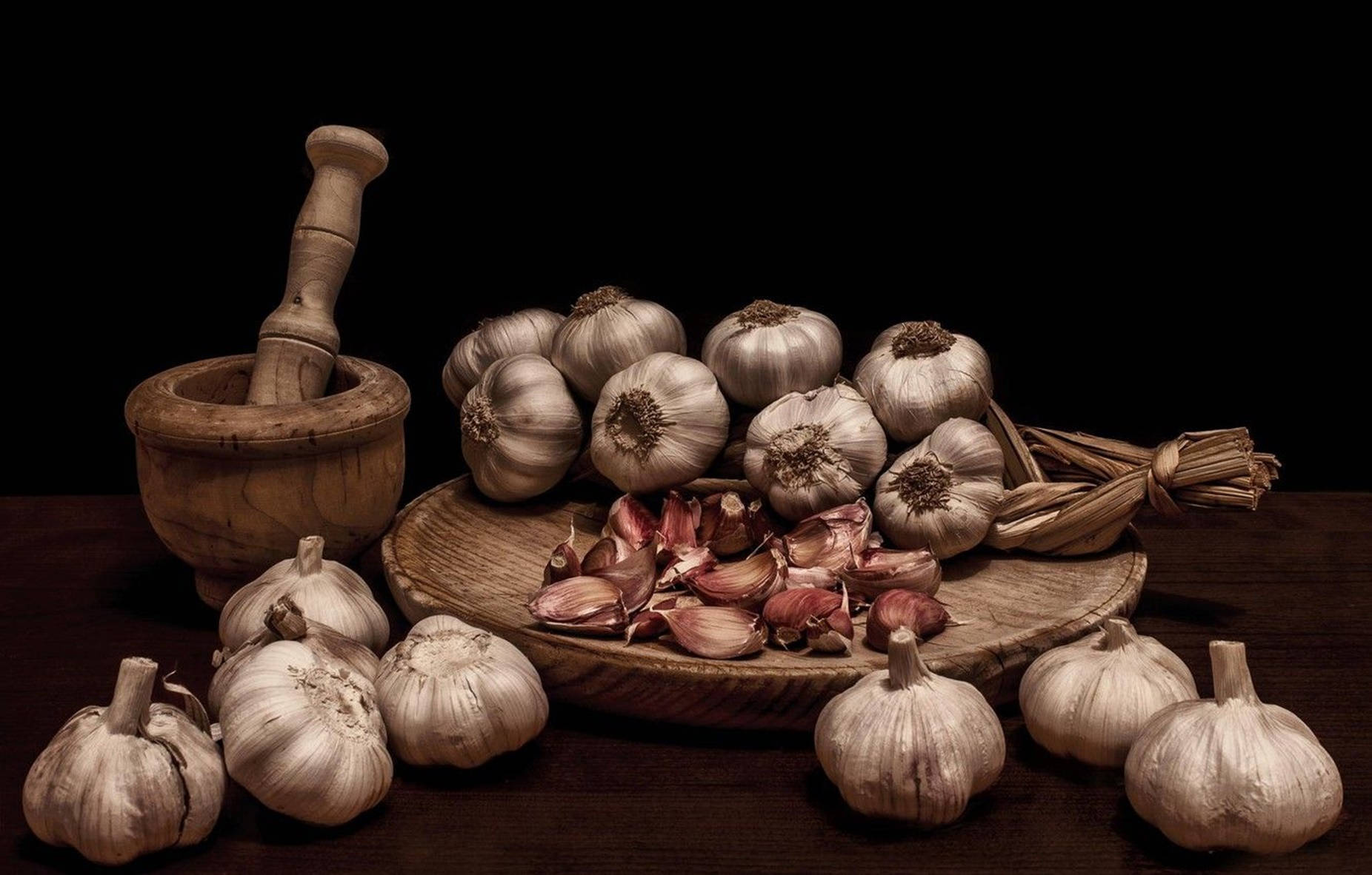 Wooden Mortar And Garlic Vegetable Background