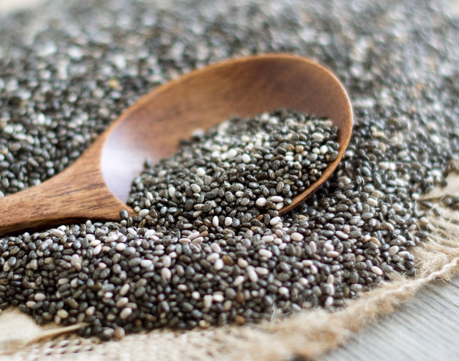 Wooden Spoon With Chia Seeds Background