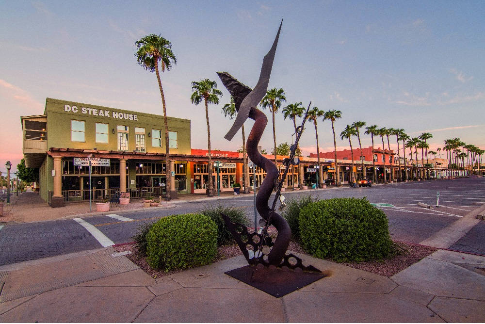 Wooden Statue In Downtown Chandler Background