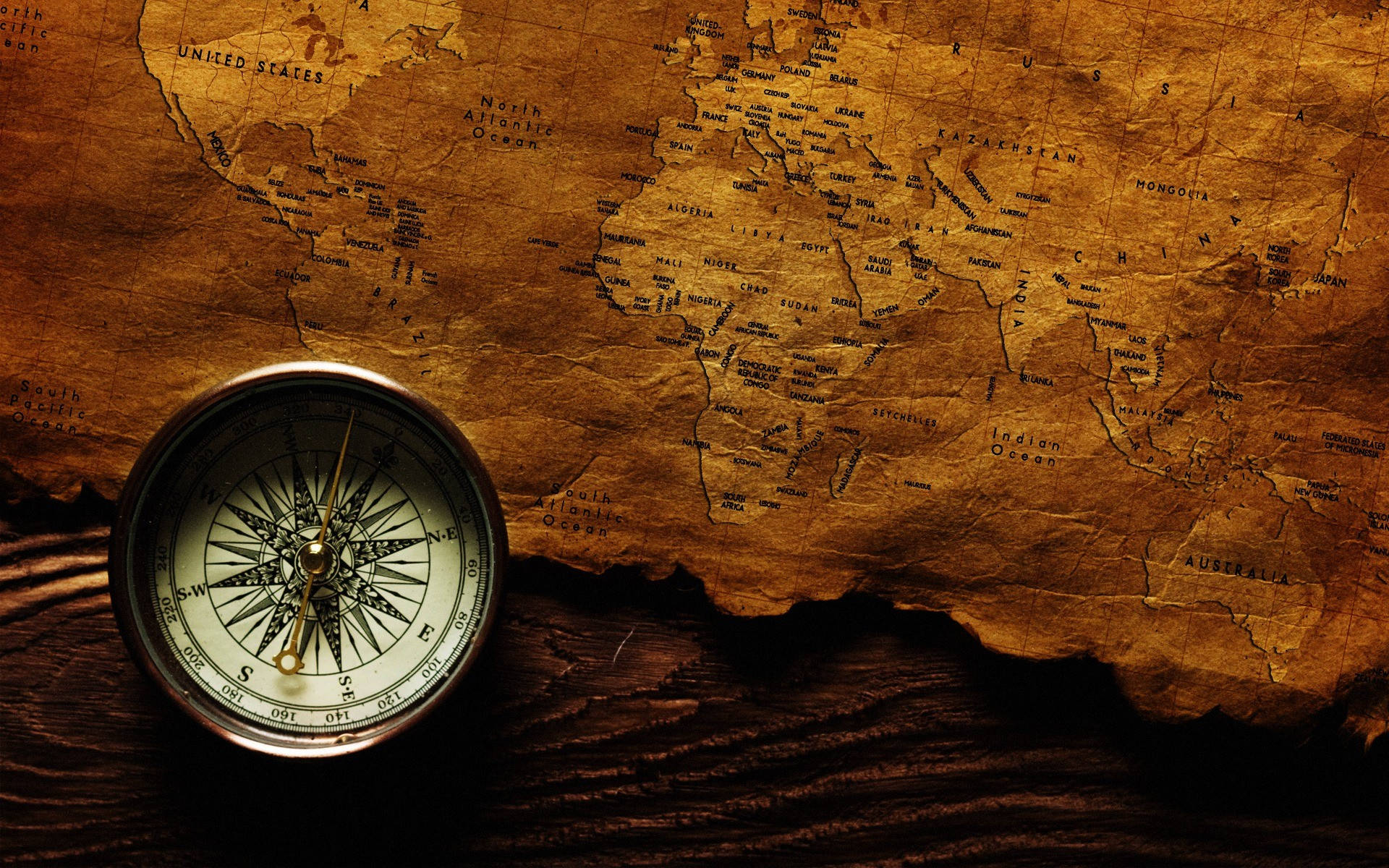 Woodsy Compass And Map On Table Background