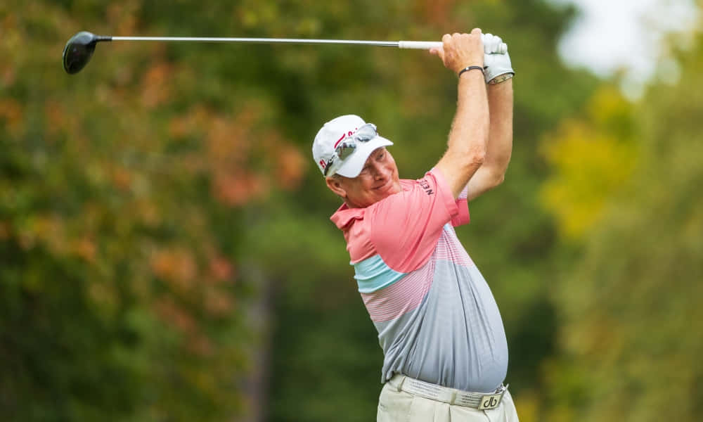 Woody Austin Delivering A Powerful Golf Swing Background