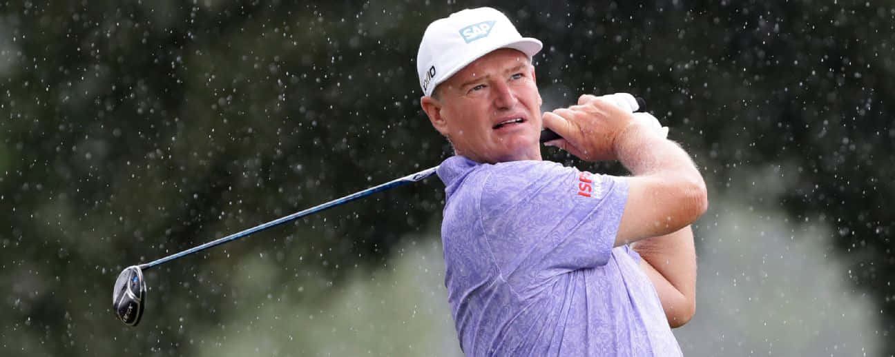 Woody Austin Swinging His Golf Club Background