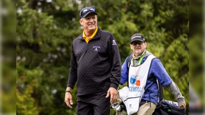Woody Austin With His Caddie Background