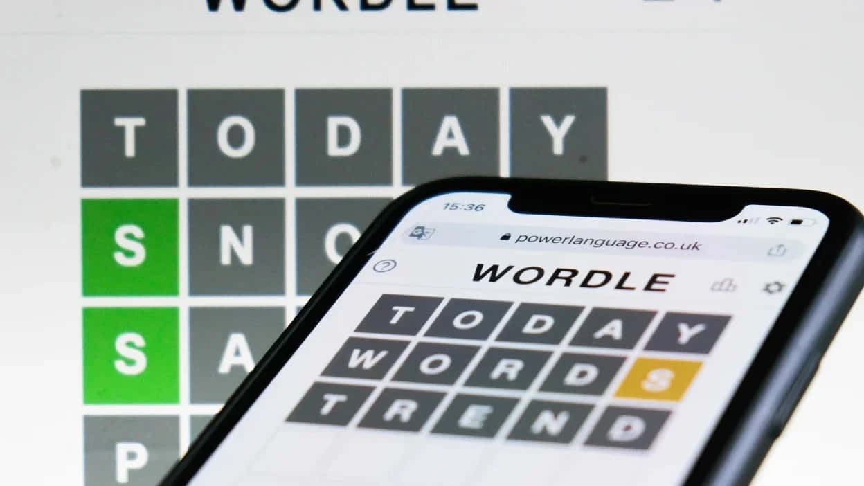 Wordle Game On Smartphoneand Computer Background