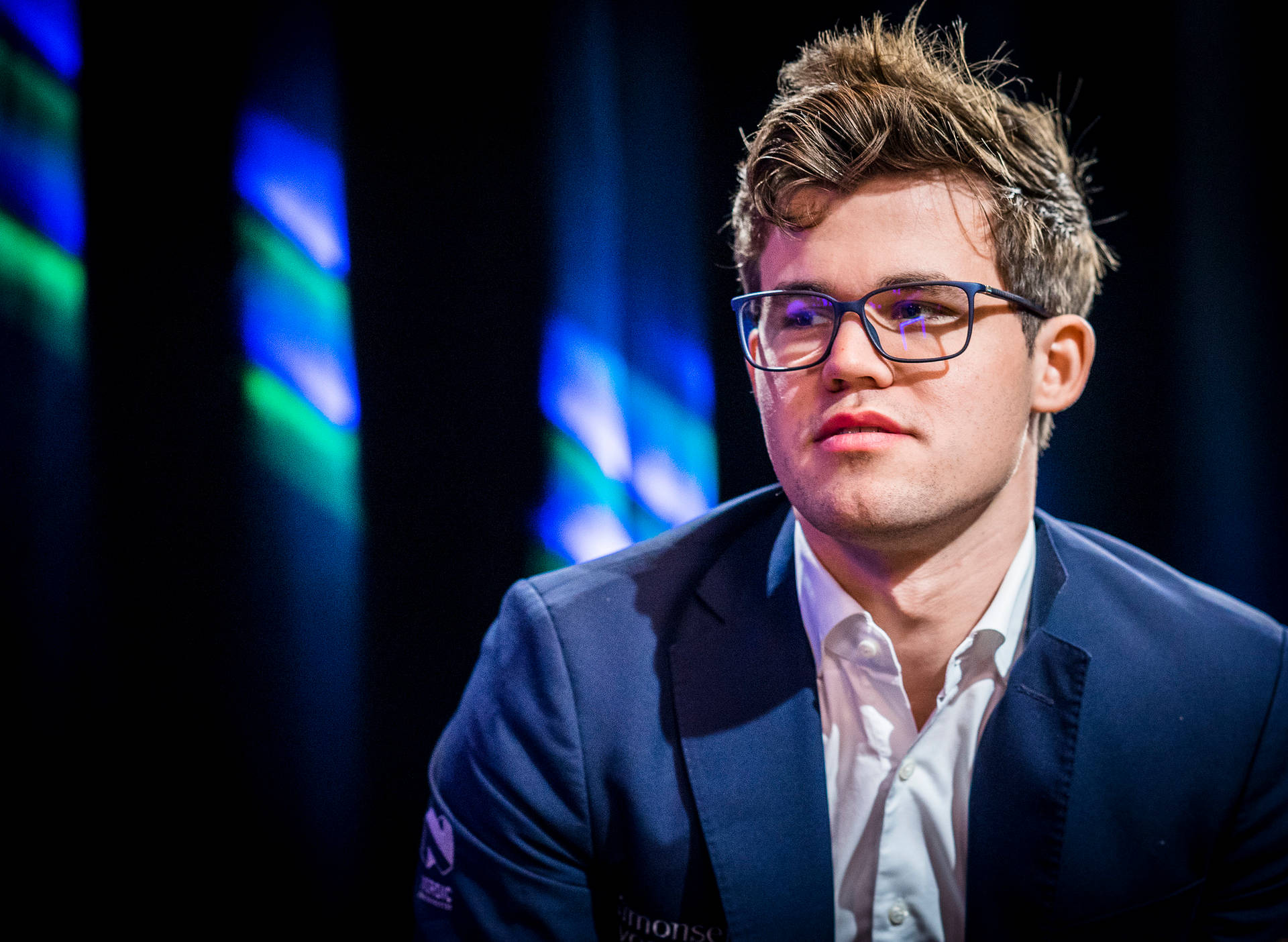 World Chess Champion Magnus Carlsen Sporting Spectacles Background