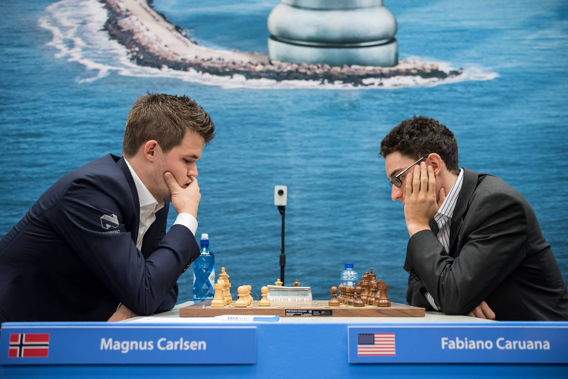 World Chess Champions Magnus Carlsen And Fabiano Caruana In Deep Contemplation During A Match. Background