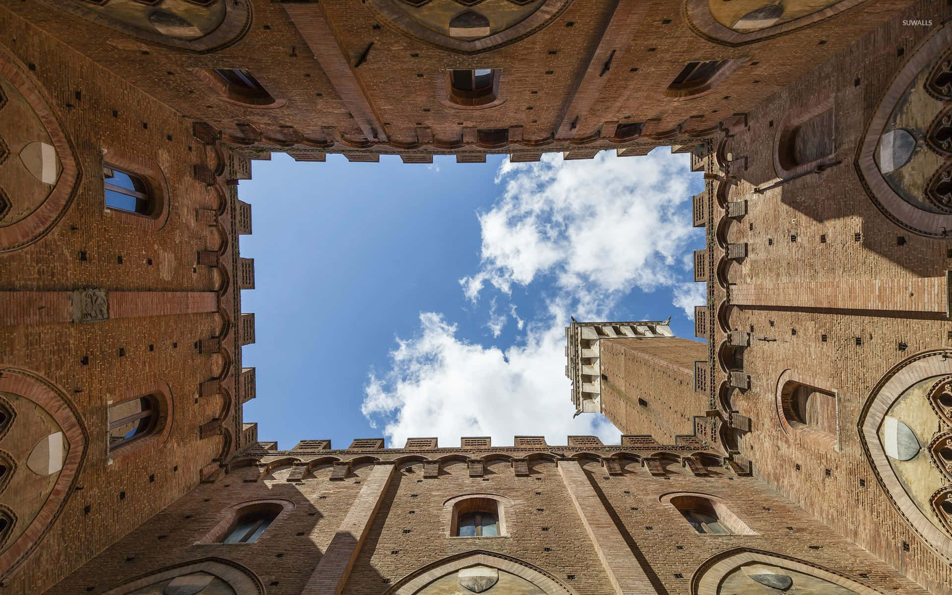 Worm's Eye View Of Pubblico Palace In Siena Italy Background