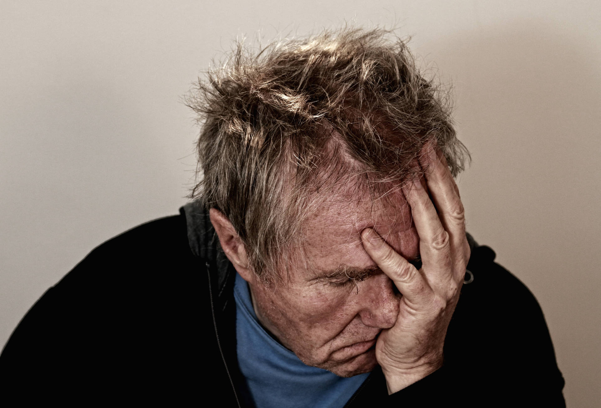 Worried Elderly Man In Deep Thought Background