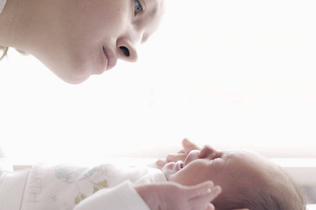 Worried Mother And Crying Baby Background