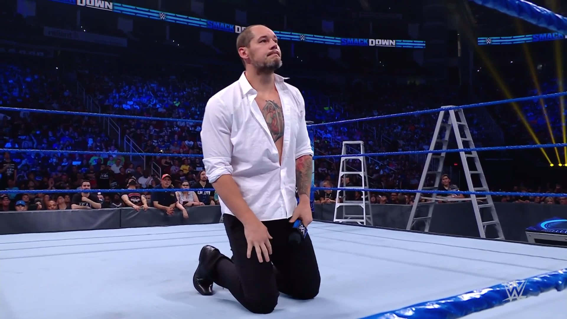 Wrestler Baron Corbin Kneeling