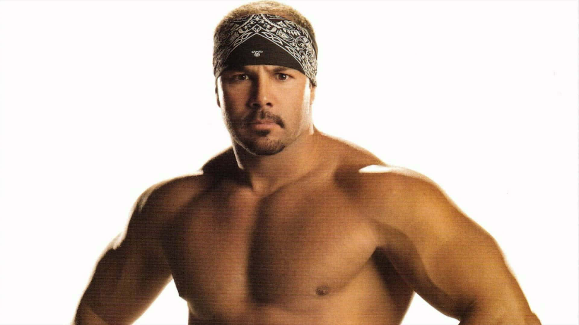 Wrestler Chavo Guererro Jr With Bandana Portrait Background