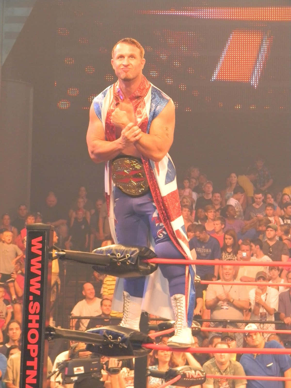 Wrestler Doug Williams With Heavyweight Belt Background