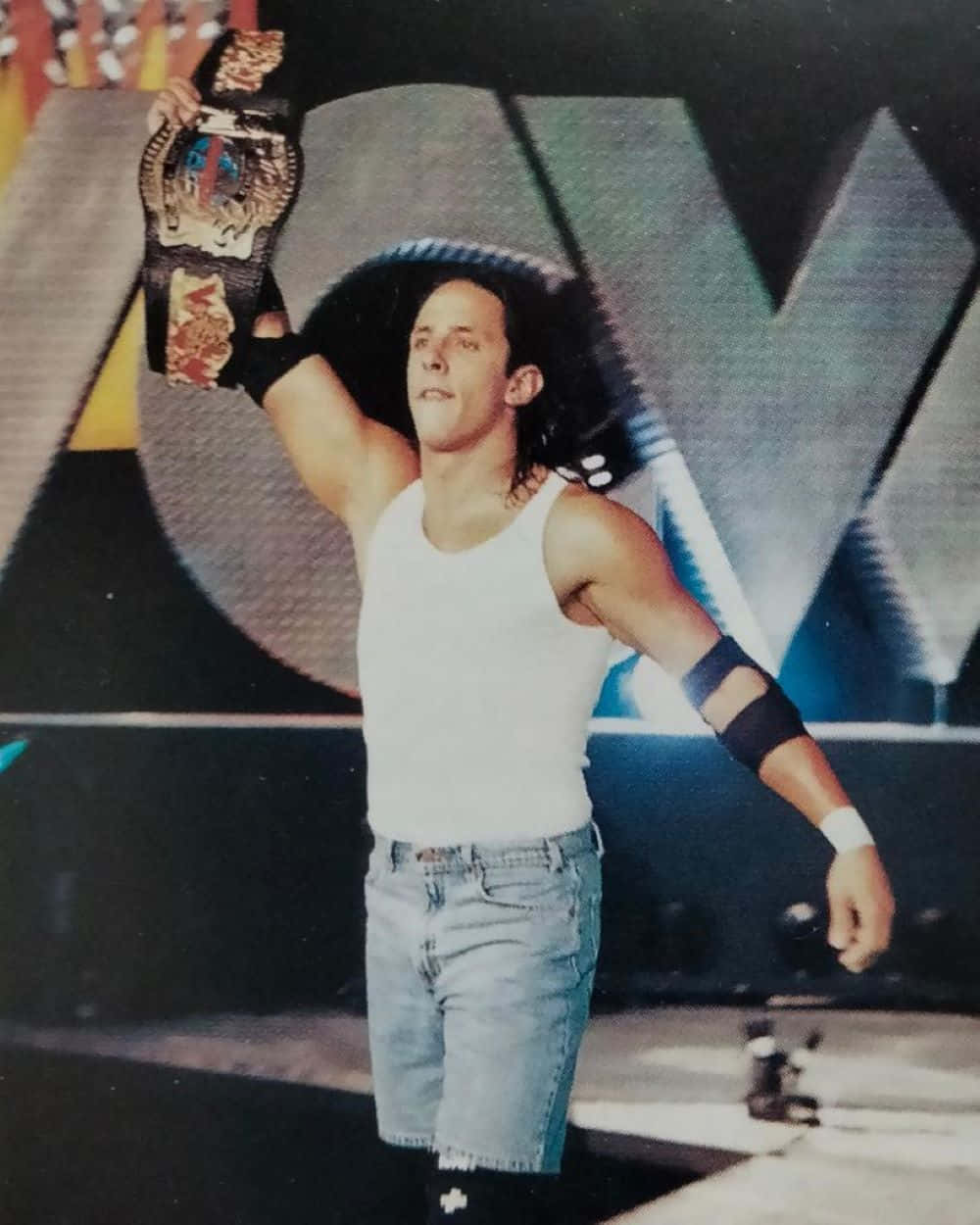 Wrestler Holding Championship Belt Background