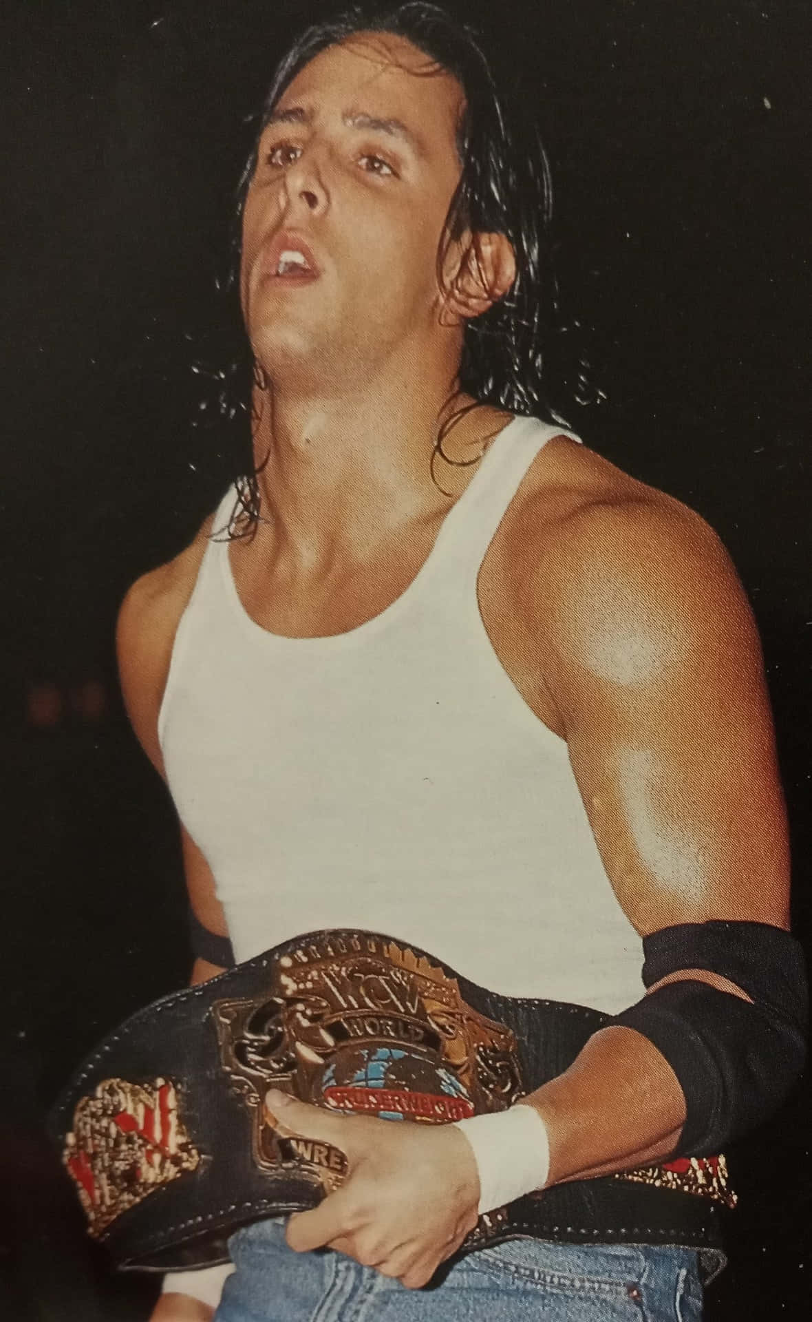 Wrestler Holding Championship Belt Background
