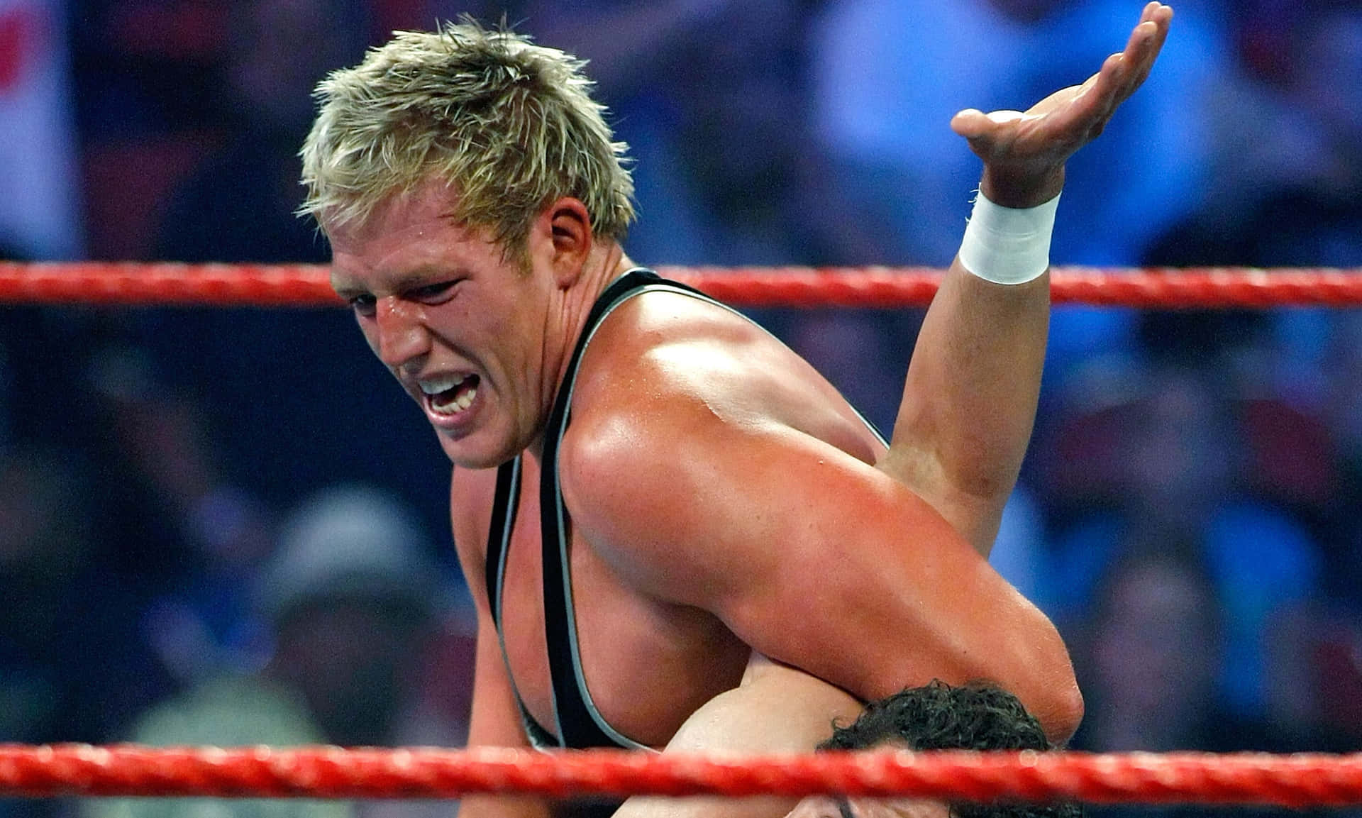 Wrestler Jake Hager Against Rusev During A Wwe Match. Background