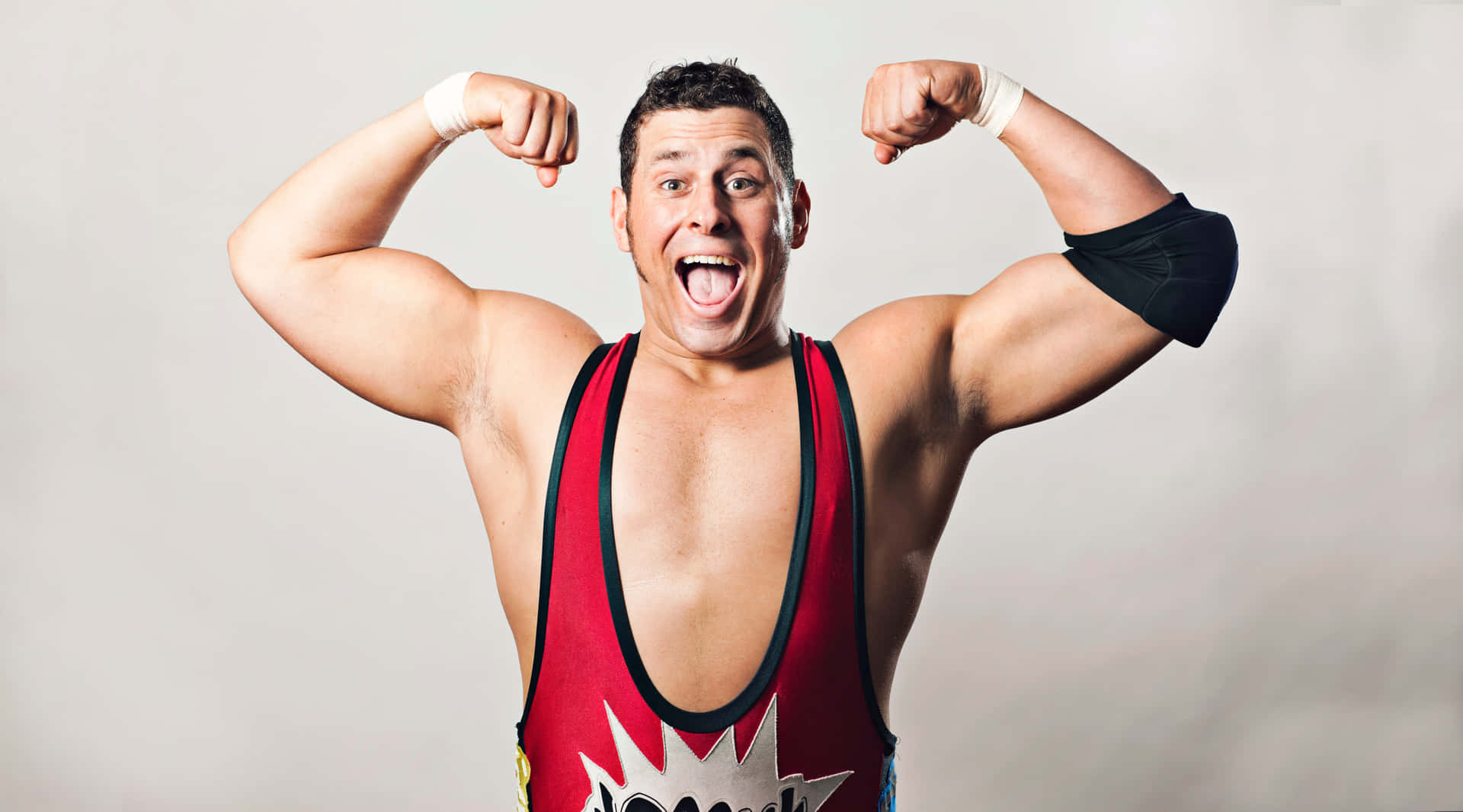 Wrestler Showing Off Muscles Background