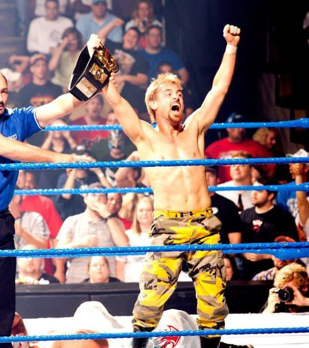 Wrestler Victory Celebrationwith Championship Belt Background