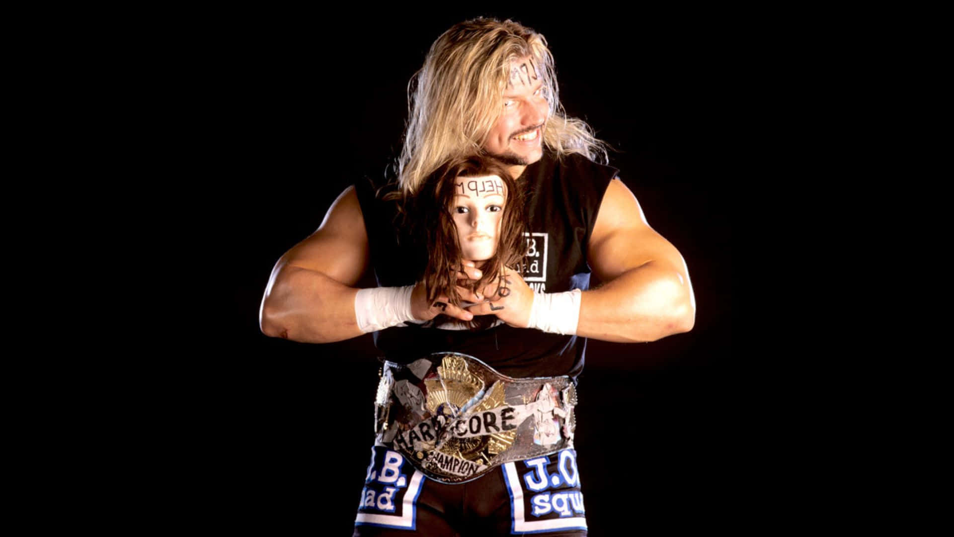 Wrestler_with_ Manikin_ Head_and_ Championship_ Belt Background