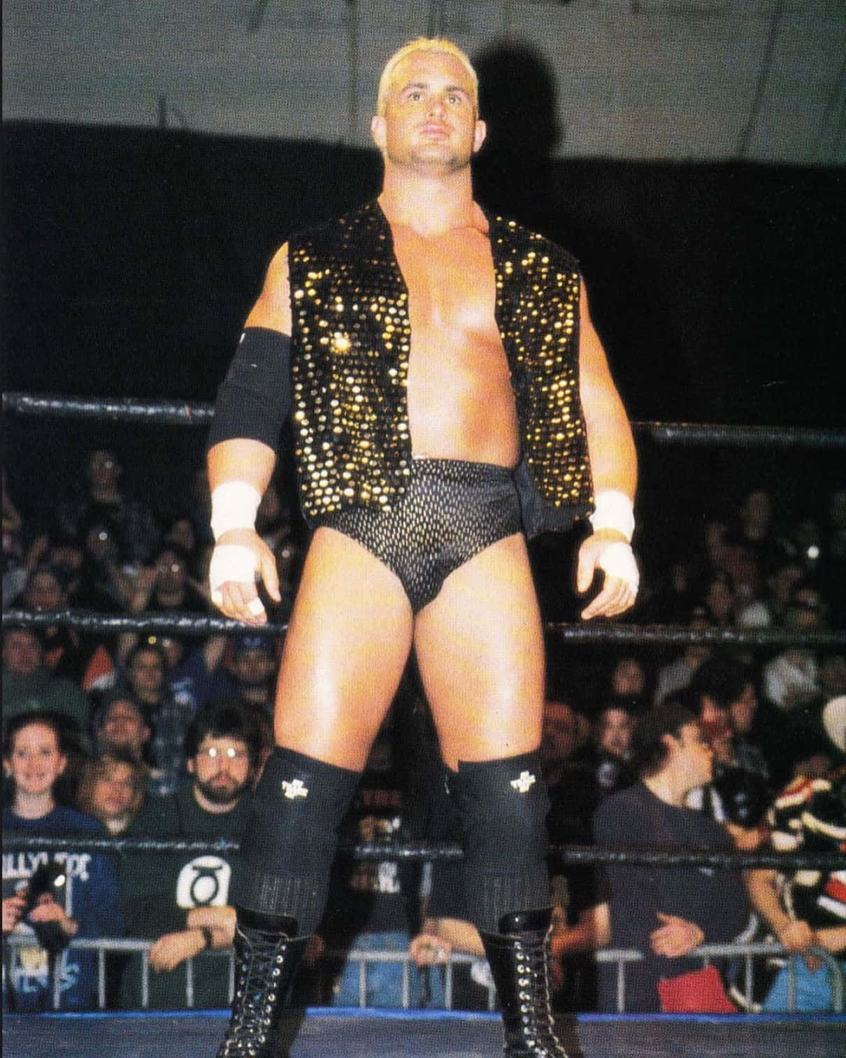 Wrestlerin Blackand Gold Attire Background