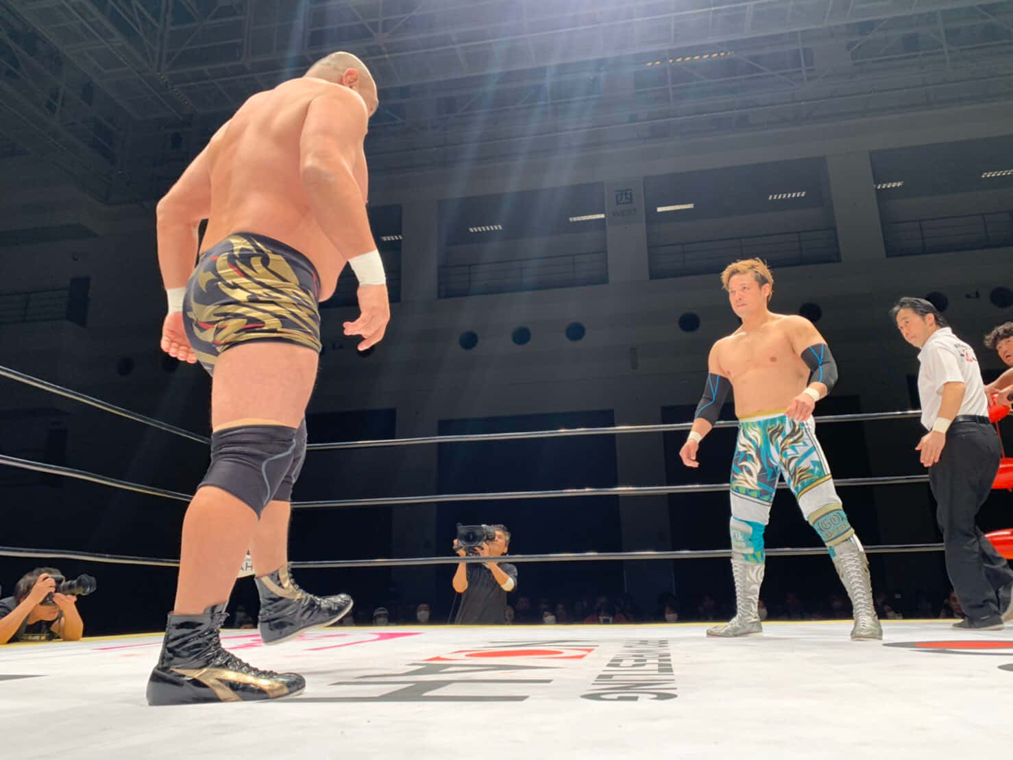 Wrestlers_ Facing_ Off_ In_ Ring.jpg Background