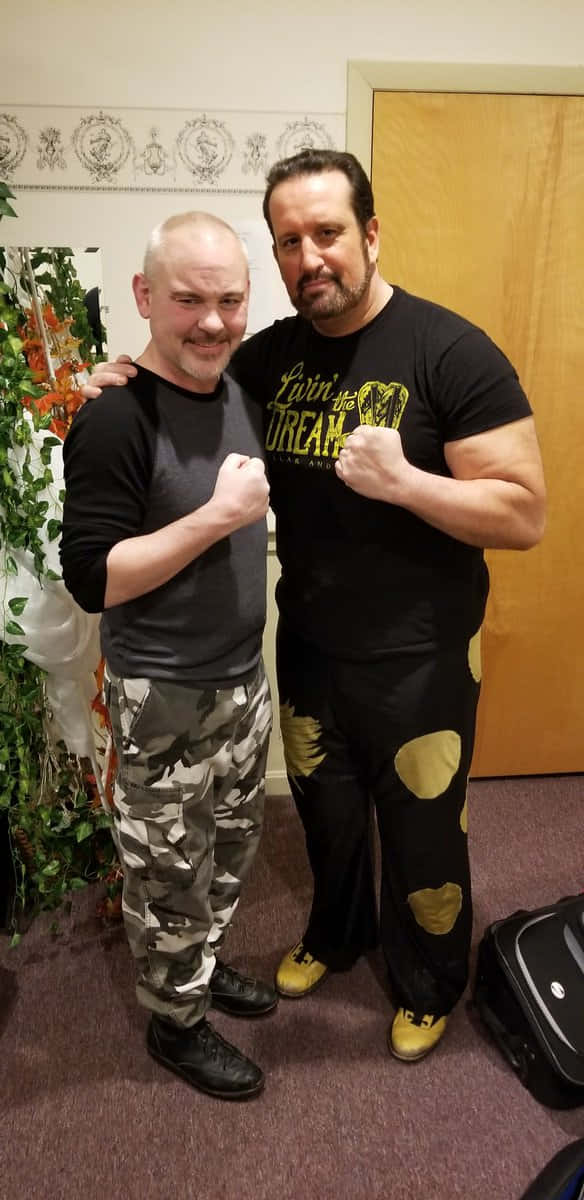 Wrestlers Pose Fist Bump Background