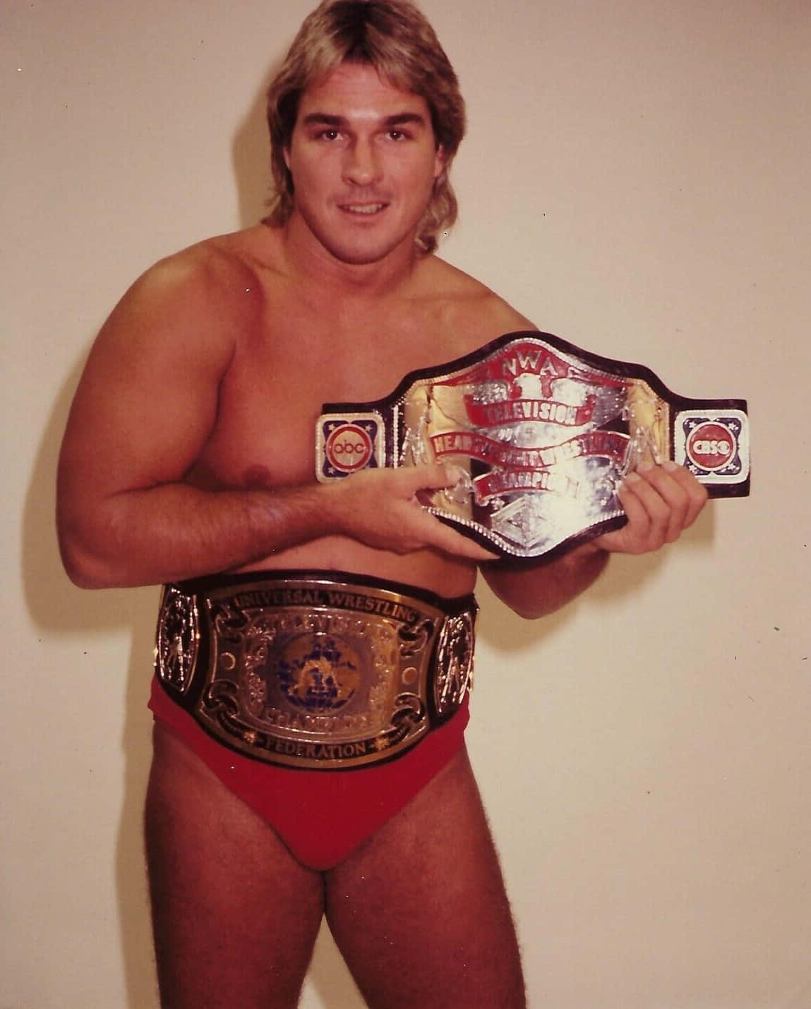 Wrestlerwith Championship Belts Background