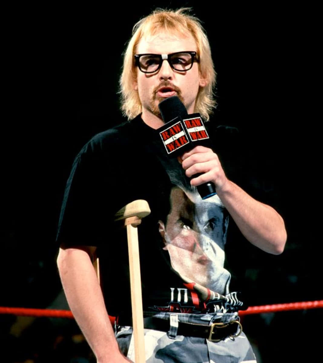 Wrestlerwith Microphoneand Crutch Background