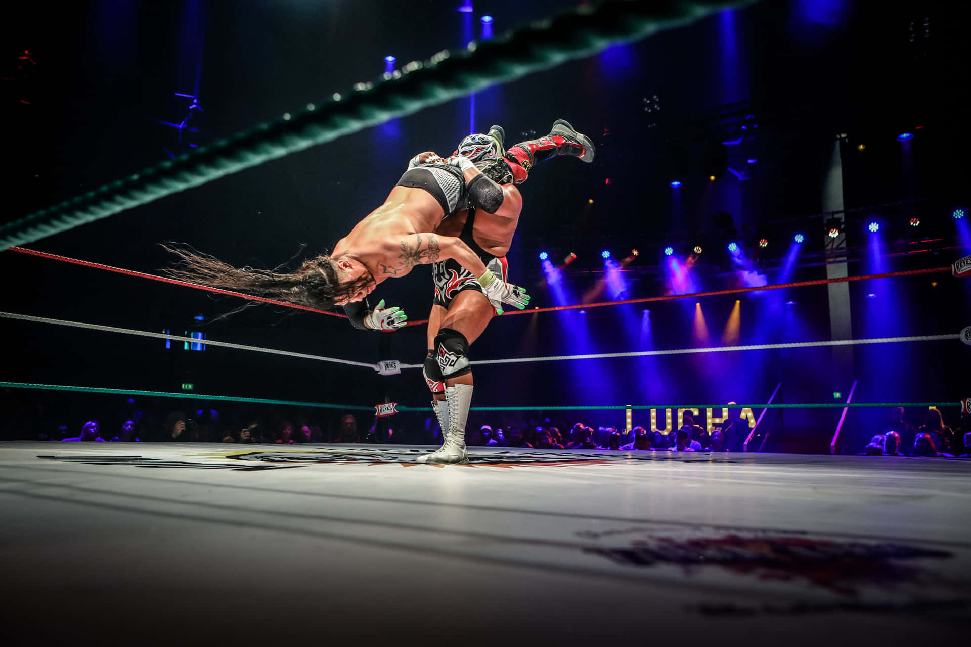 Wrestling Move Execution In Ring Background
