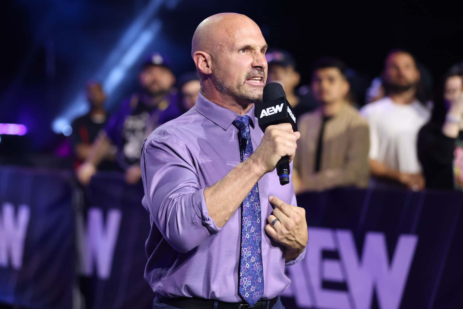 Wrestling Promoter Speakingat A E W Event Background