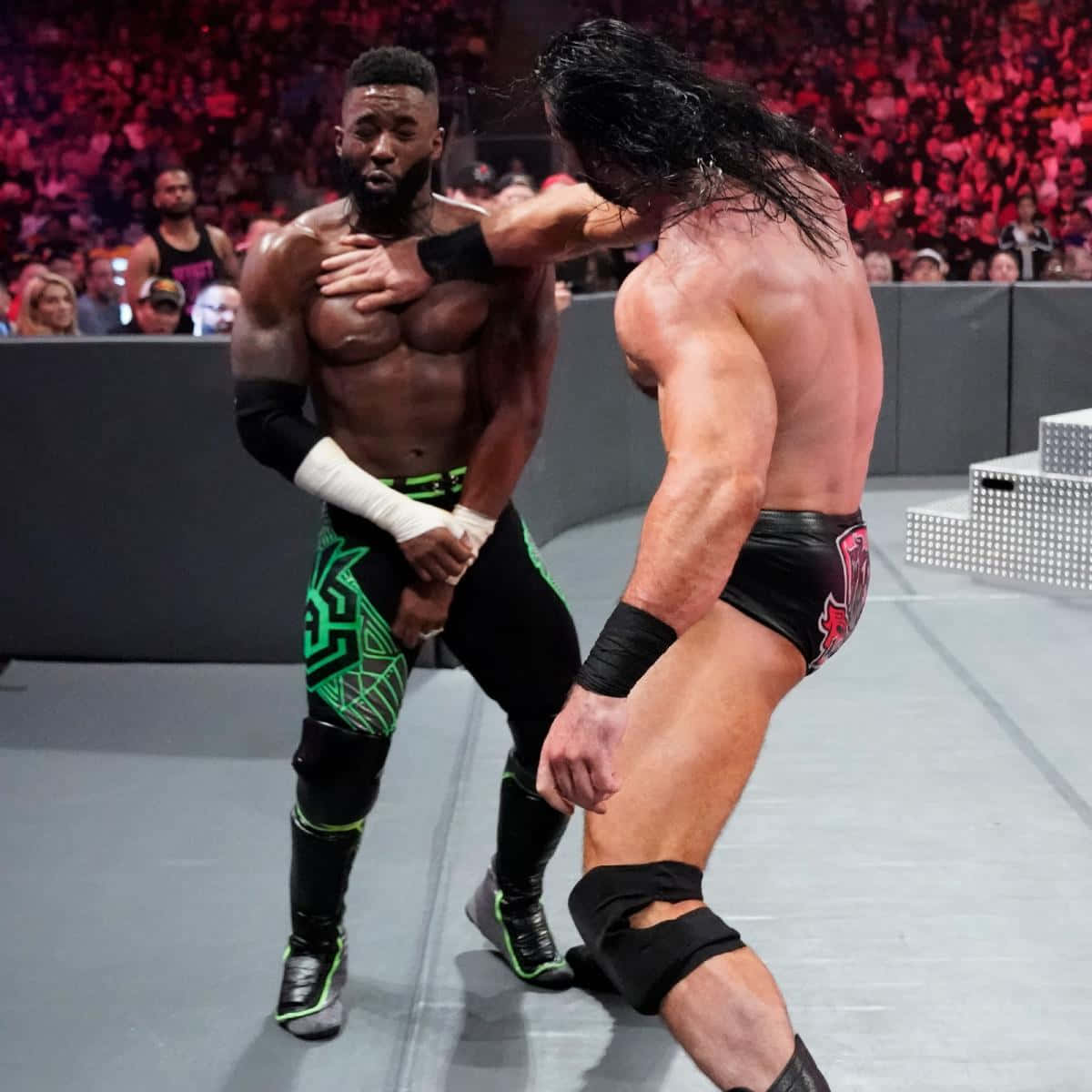 Wrestling Showdown: Cedric Alexander Vs. Drew Mcintyre In Wwe Background