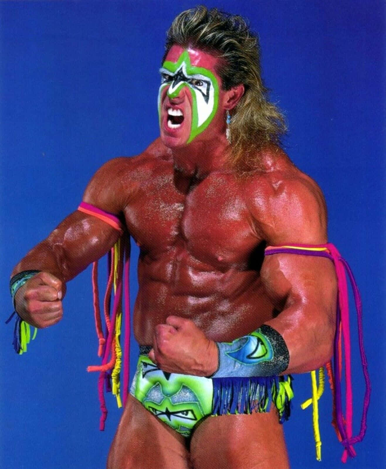 Wwe Legend - The Ultimate Warrior In His Iconic Neon Costume Background