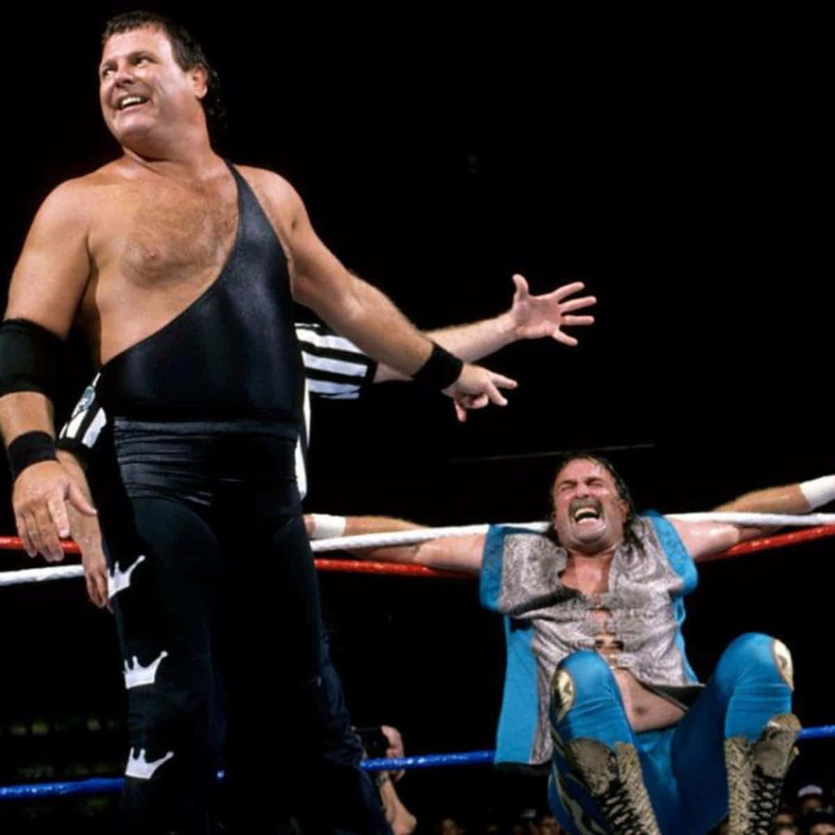 Wwe Legends Jake Roberts And Jerry Lawler In The Ring Background