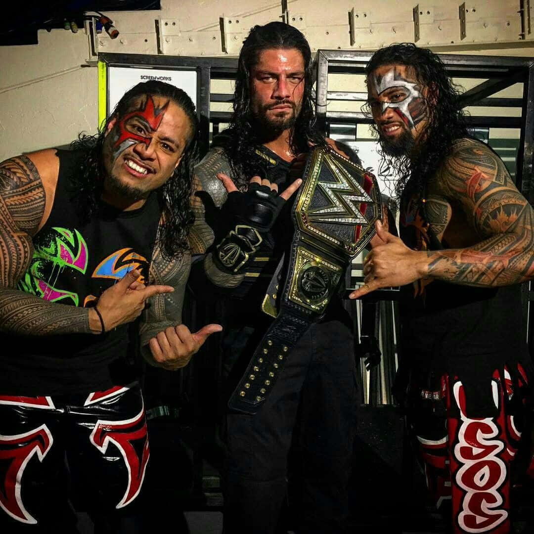 Wwe Roman Reigns With Jimmy And Jey Uso Background