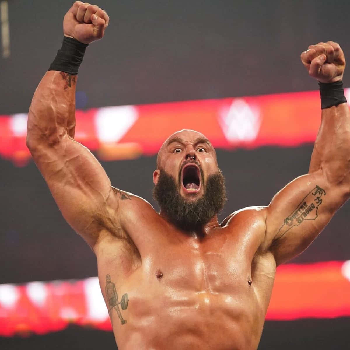 Wwe Superstar Braun Strowman In Full Intensity During A Wrestling Event. Background