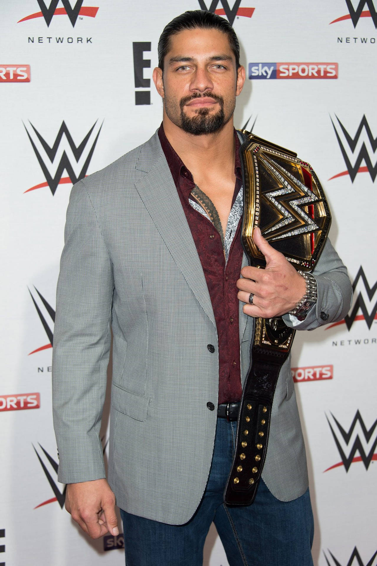 Wwe Superstar Roman Reigns On Raw Red Carpet Background