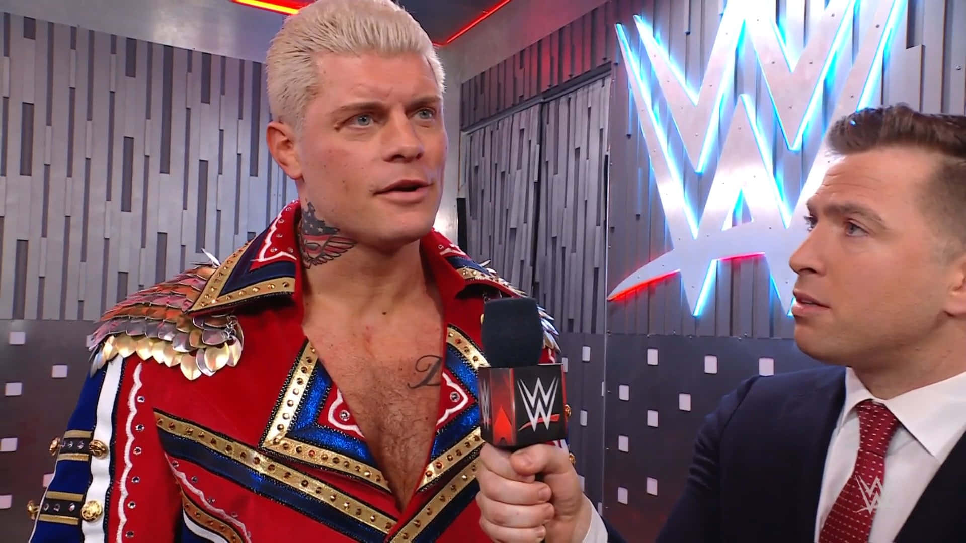 Wwe Wrestler Cody Rhodes During An Engaging Interview. Background