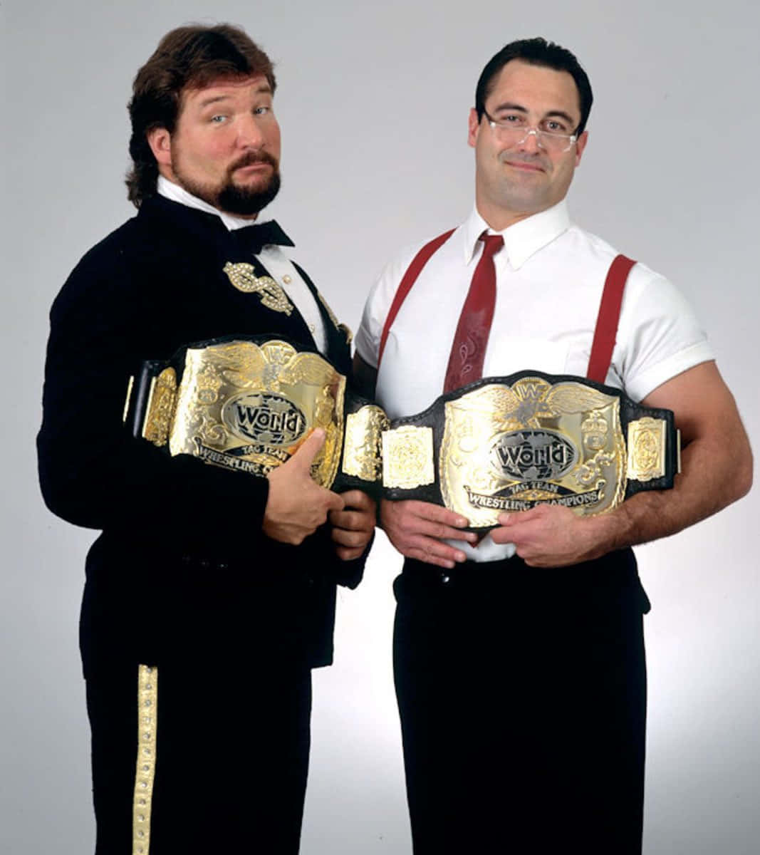 Wwf World Tag Team Champions Ted Dibiase And Mike Rotunda Background