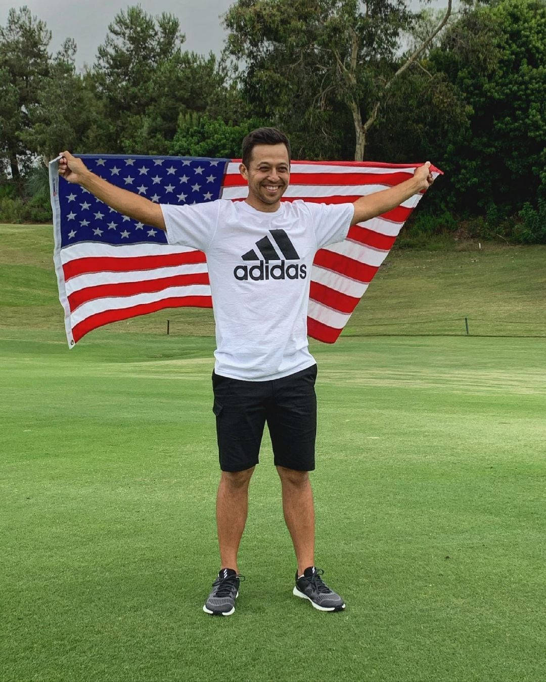 Xander Schauffele Holding A Usa Flag