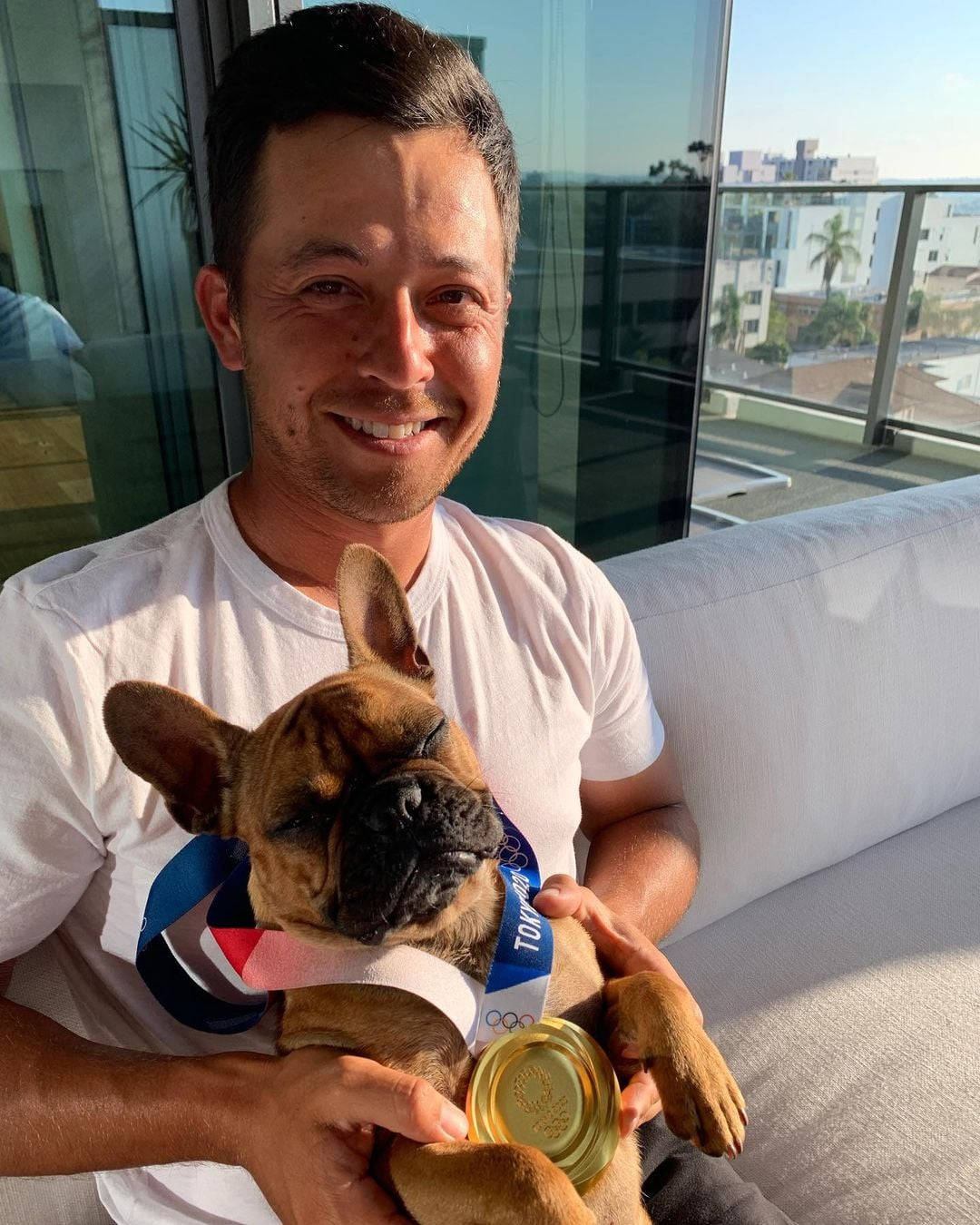 Xander Schauffele With Sleeping Dog