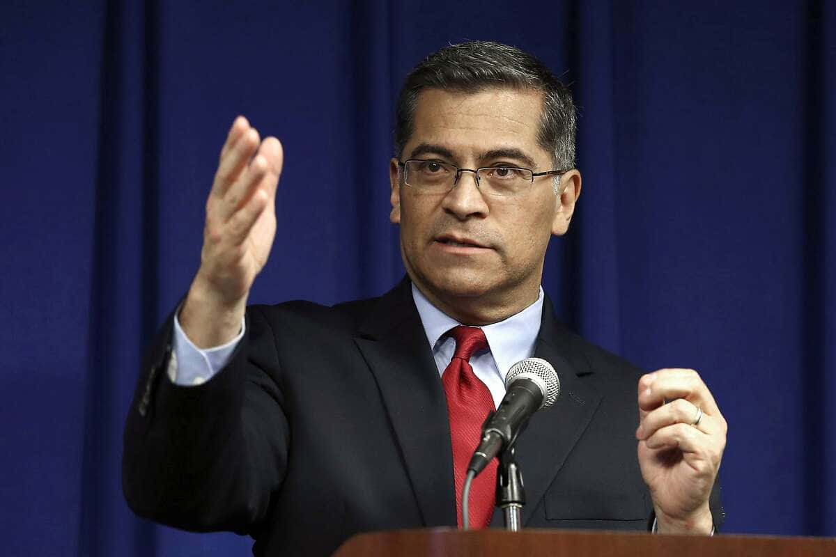 Xavier Becerra Gesturing At Something Background
