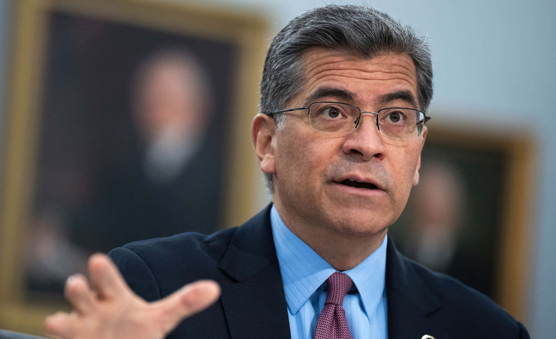Xavier Becerra Immersed In The Meeting Background