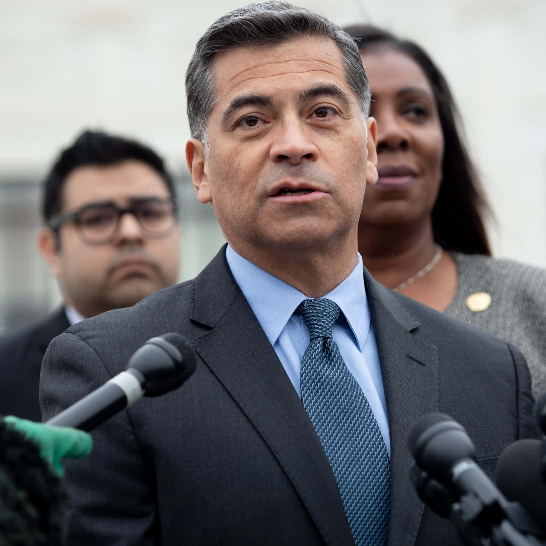 Xavier Becerra Wearing A Blue Tie Background