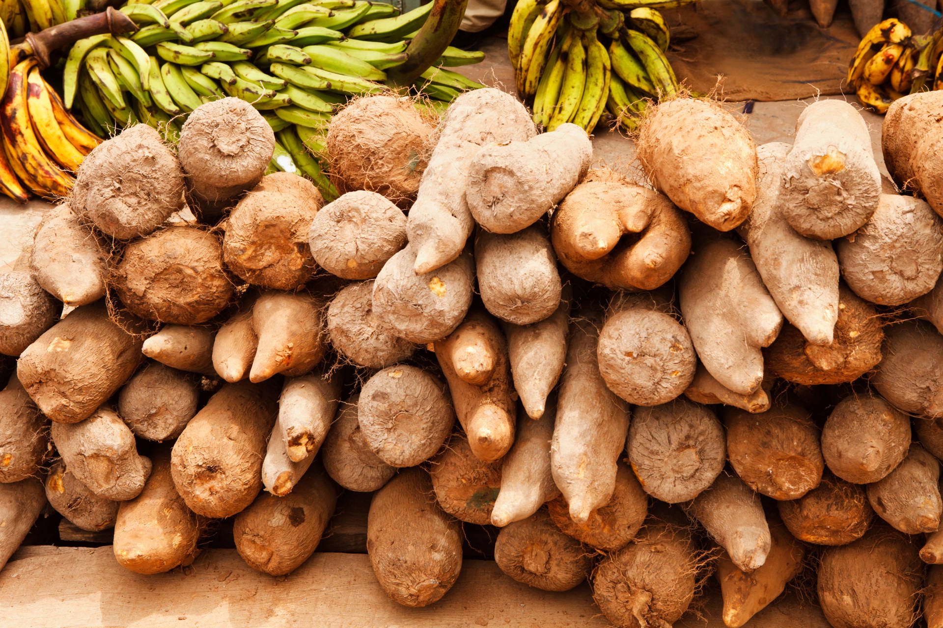 Yam And Bananas In Marketplace Background