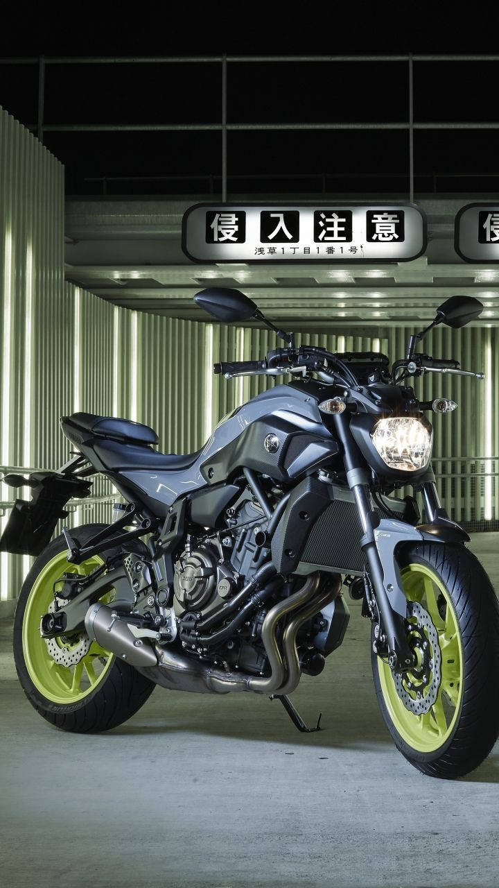 Yamaha Mt 15 With Yellow Green Rims Background