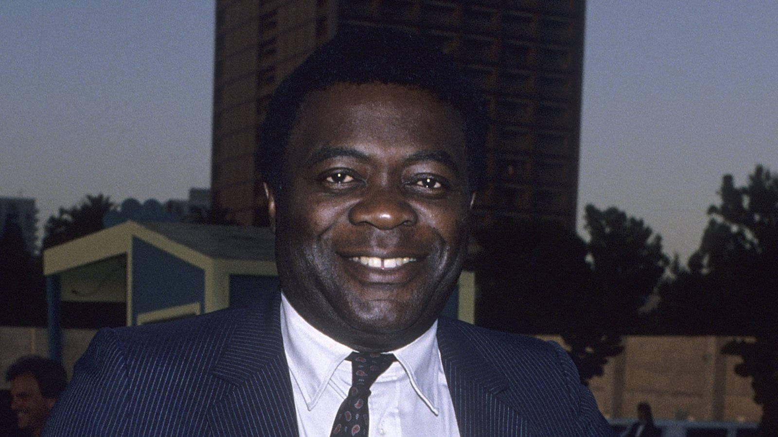 Yaphet Kotto In A Blue Suit Background