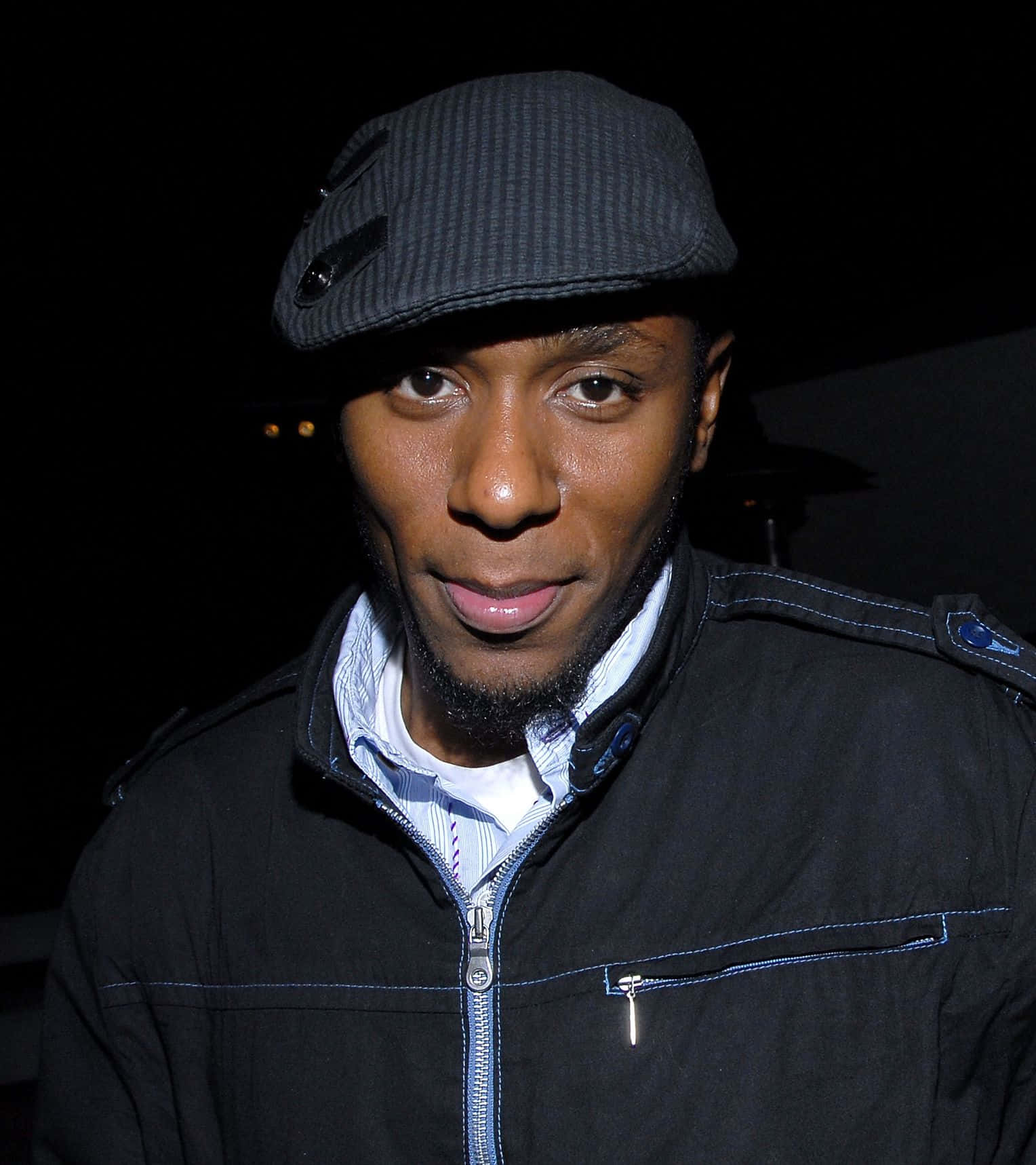 Yasiin Bey In A Promotional Photo Shoot Background