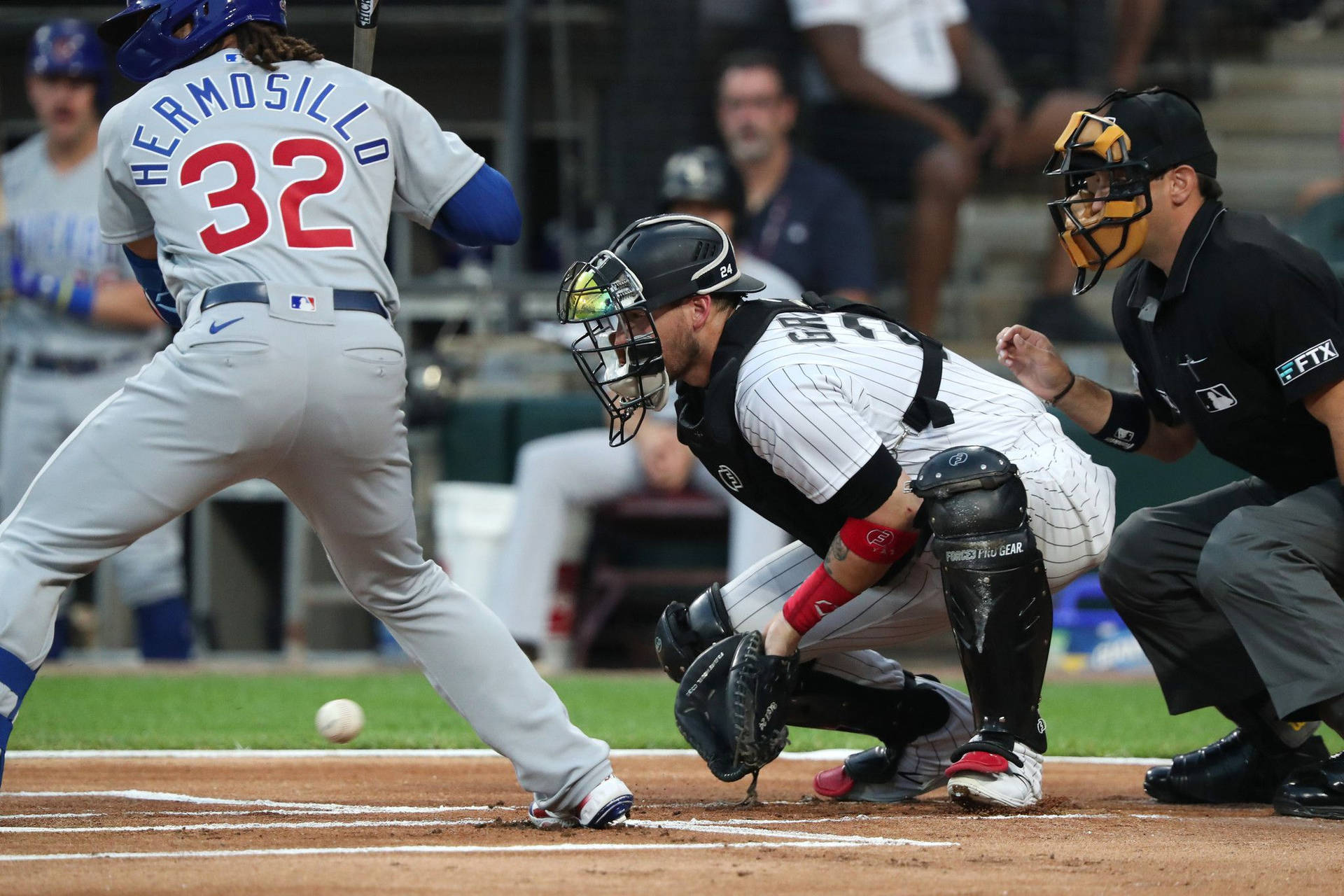 Yasmani Grandal In Action On The Baseball Field Background