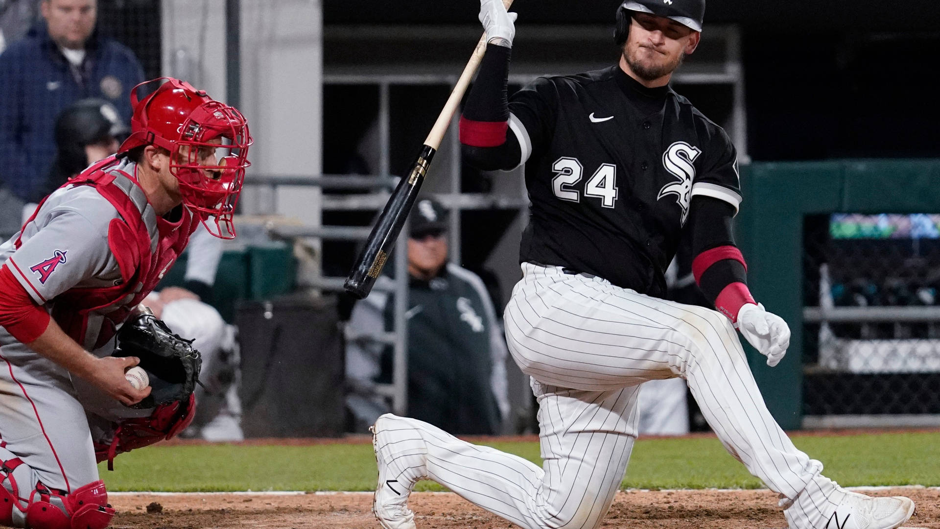 Yasmani Grandal Kneeling With Baseball Bat Background