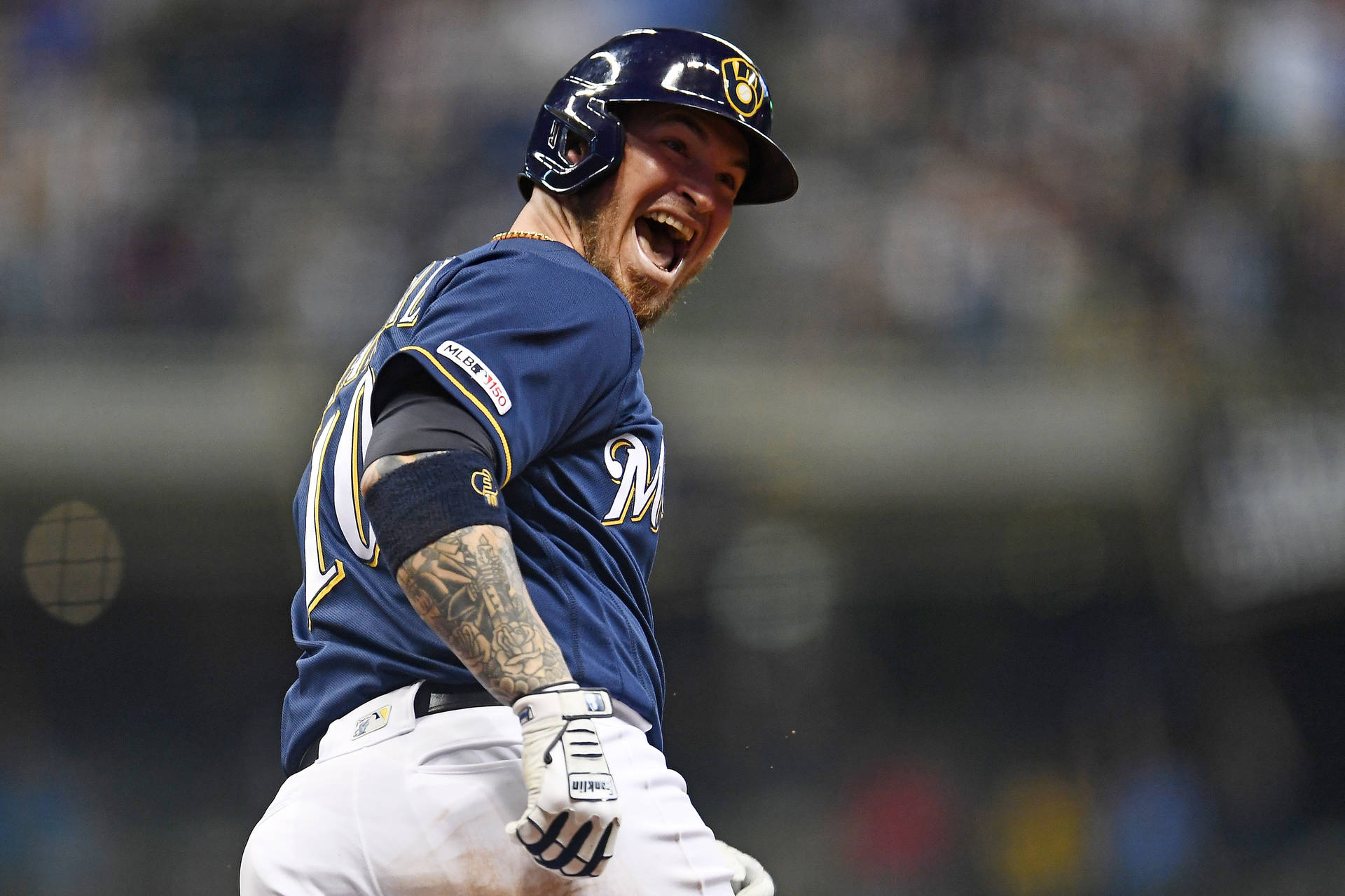 Yasmani Grandal Laughing While Wearing Helmet Background